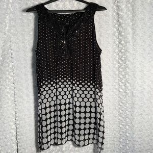 Sequins embellish the chest & neck